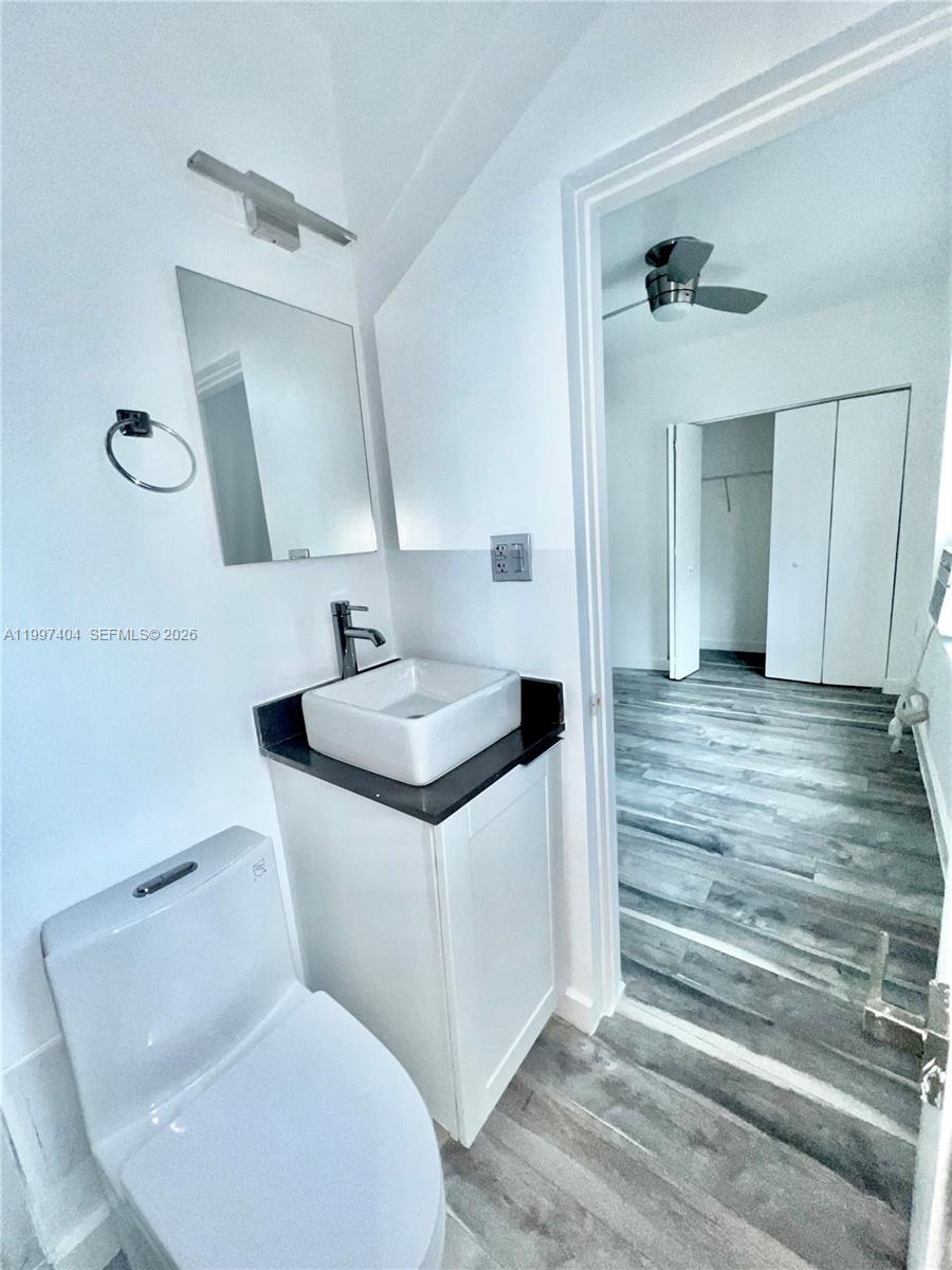 1036 Southwest 5th Street, Unit 12 Miami, FL 33130 - Photo 17 of 19 a bathroom with a sink and a mirror