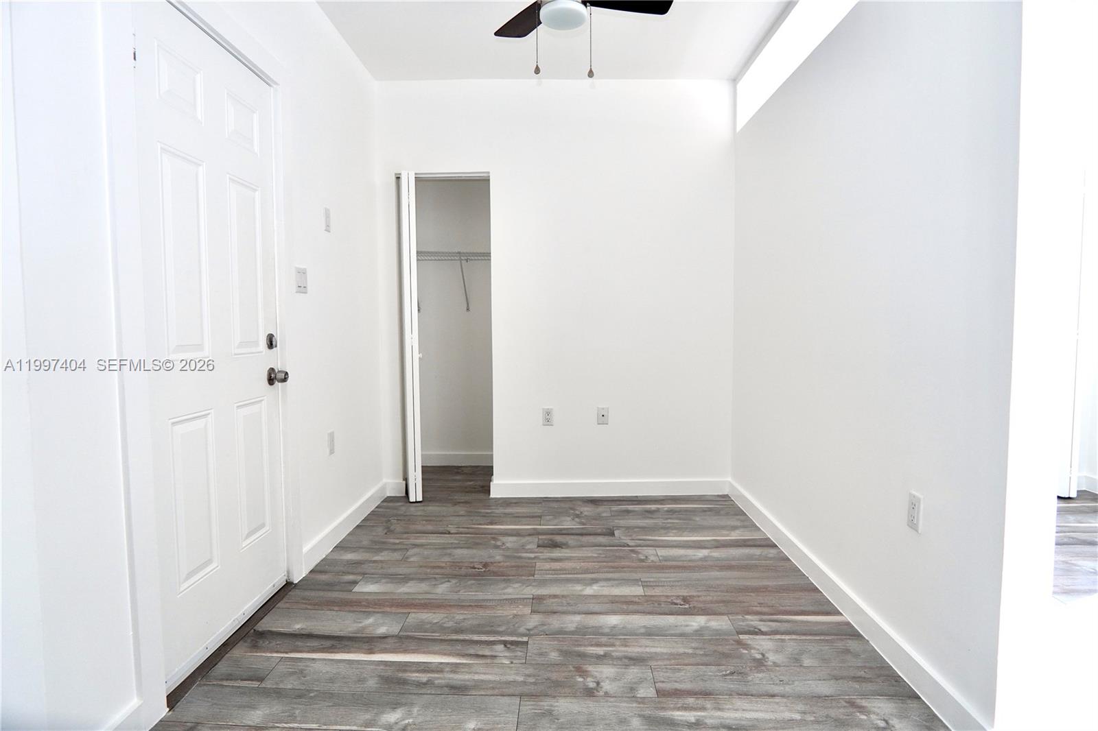 1036 Southwest 5th Street, Unit 12 Miami, FL 33130 - Photo 6 of 19 a view of a hallway with wooden floor