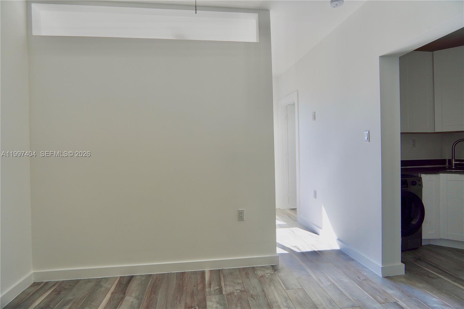 1036 Southwest 5th Street, Unit 12 Miami, FL 33130 - Photo 7 of 19 a view of an empty room with wooden floor and closet