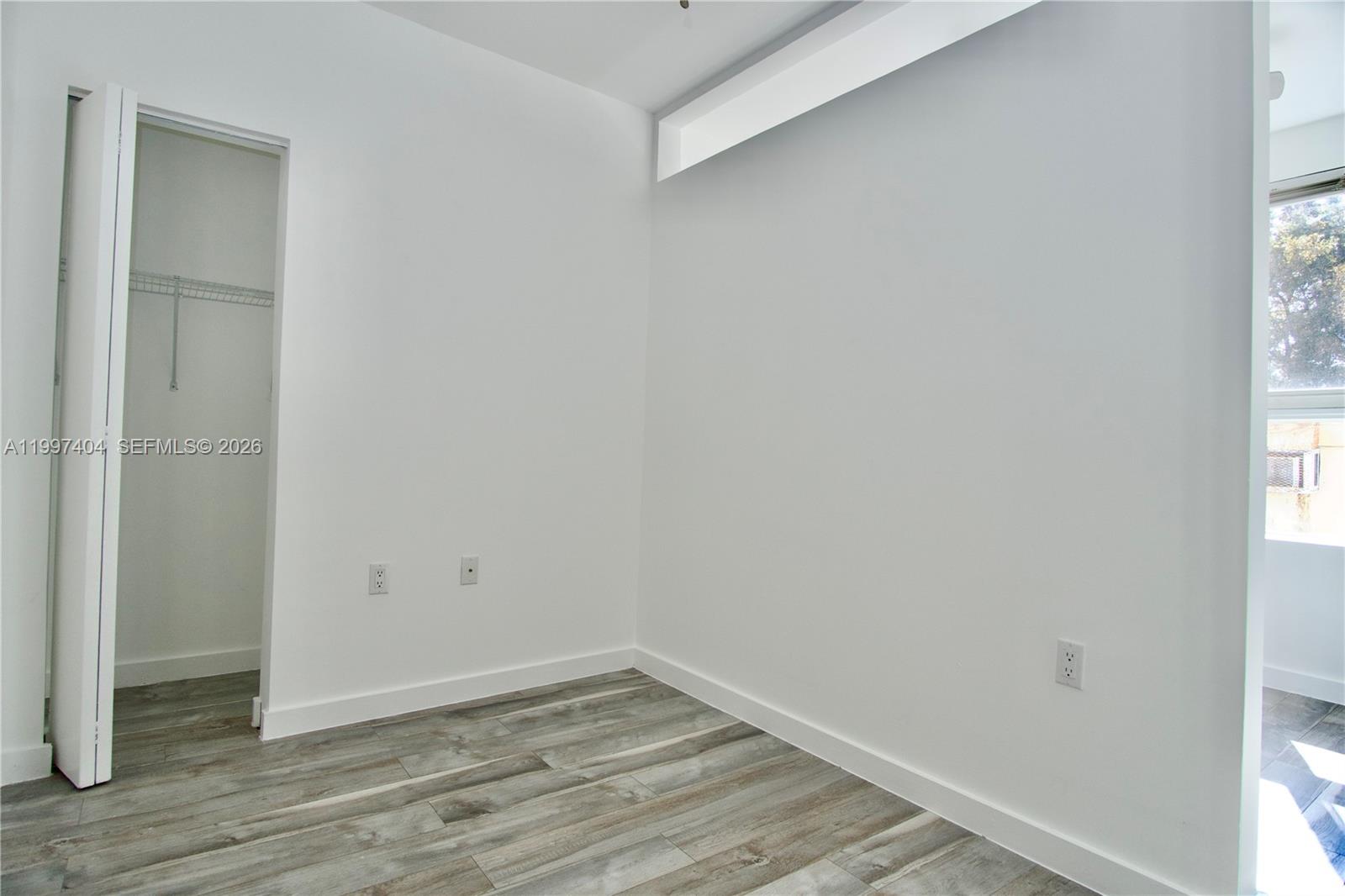 1036 Southwest 5th Street, Unit 12 Miami, FL 33130 - Photo 8 of 19 a view of small space with wooden floor