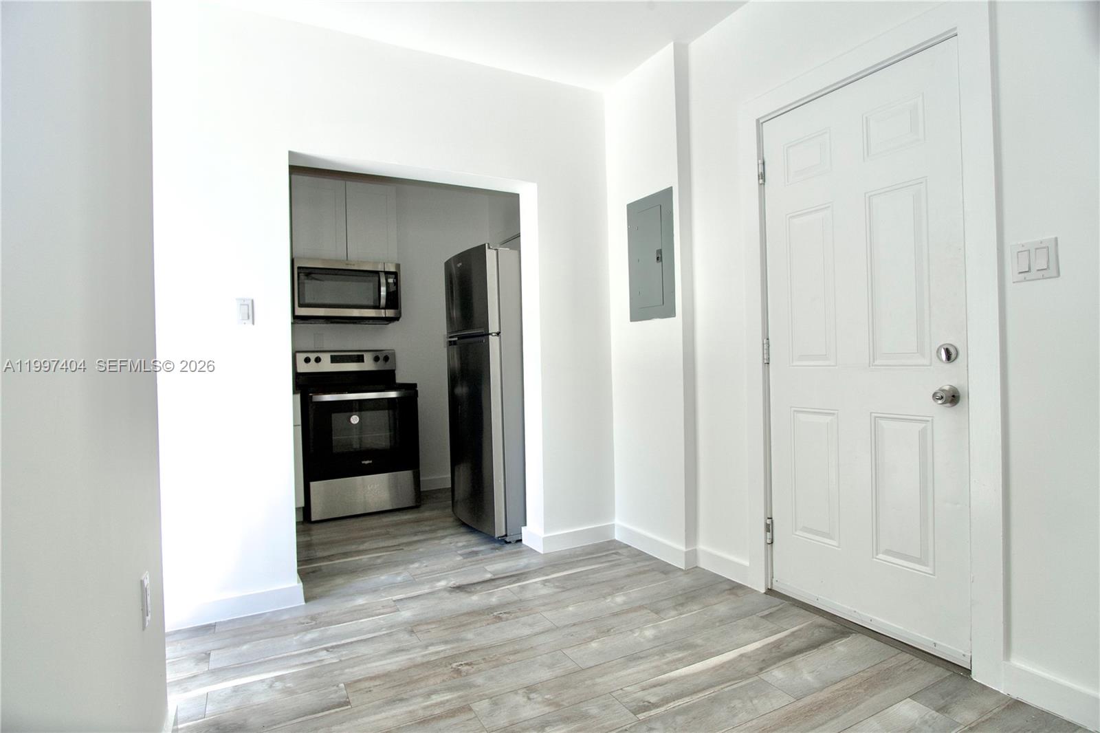 1036 Southwest 5th Street, Unit 12 Miami, FL 33130 - Photo 10 of 19 a view of a kitchen from the hallway