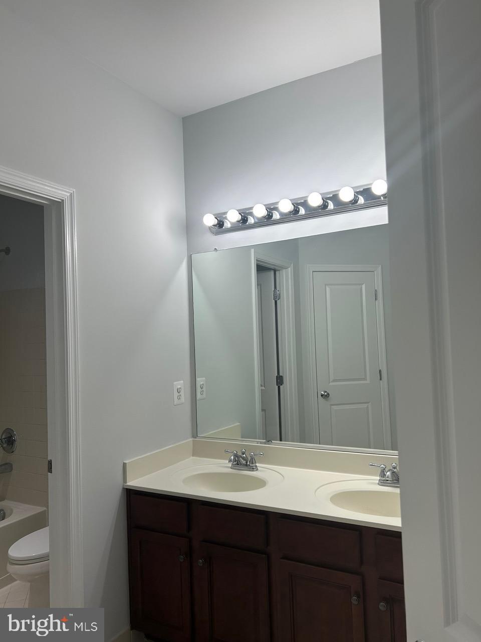 1101 Verbena Court Silver Spring, MD 20906 - Photo 25 of 36 a bathroom with a sink and a mirror