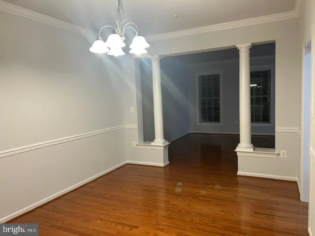 a view of a livingroom with wooden floor
