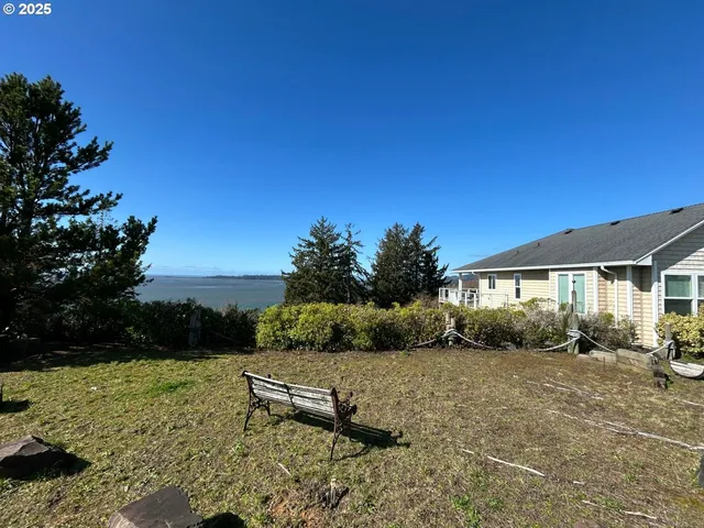 a view of a backyard with sitting area