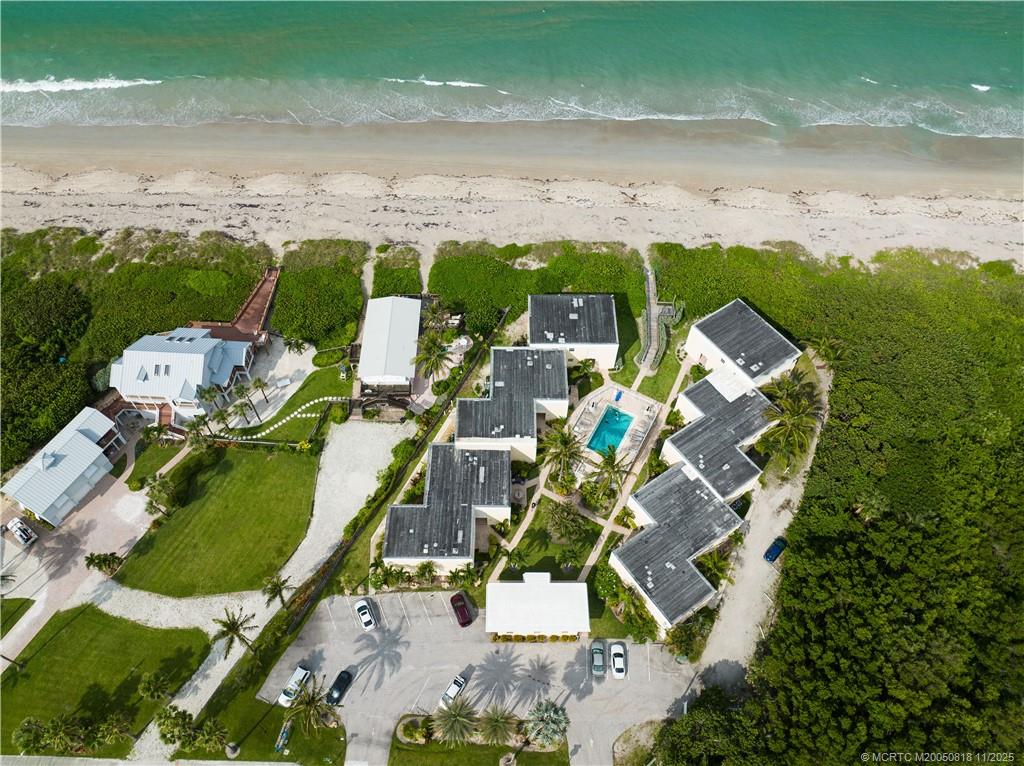 3541 Northeast Ocean Boulevard, Unit 14 Stuart, FL 34996 - Photo 14 of 15 an aerial view of a house with a yard