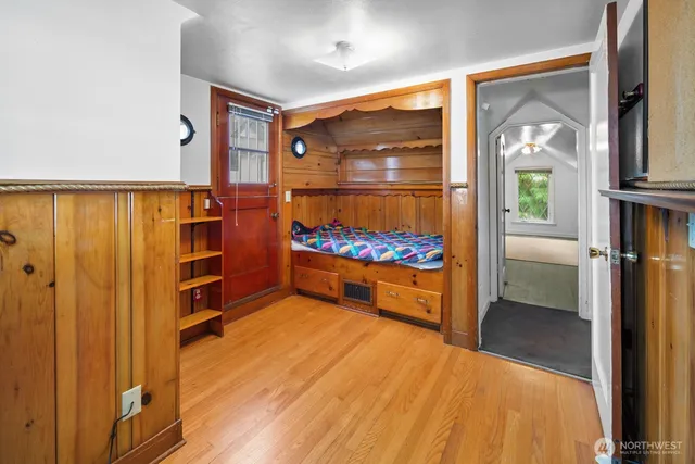 a bedroom with furniture and a window