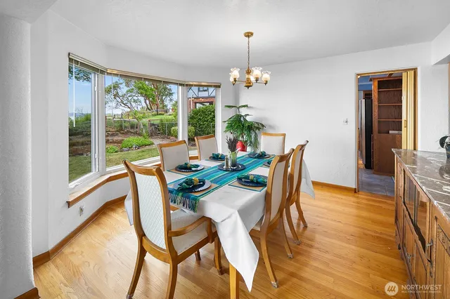 a view of a dining room with furniture window and outside view