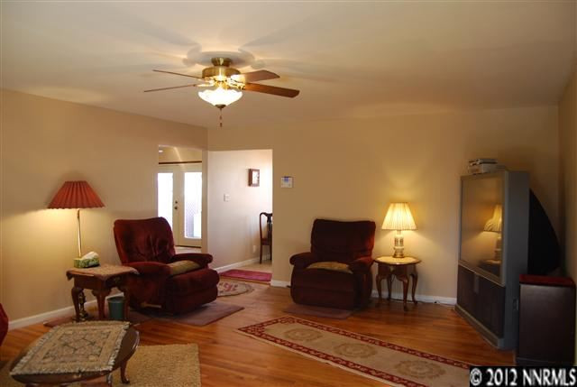 2495 West 7th Street Reno, NV 89503 - Photo 1 of 1 a living room with furniture and a lamp