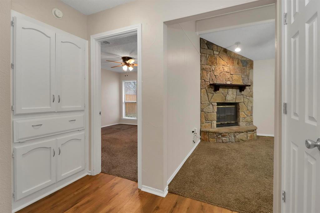 6632 Valley View Drive Watauga, TX 76148 - Photo 7 of 18 wooden floor in an empty room and a mirror