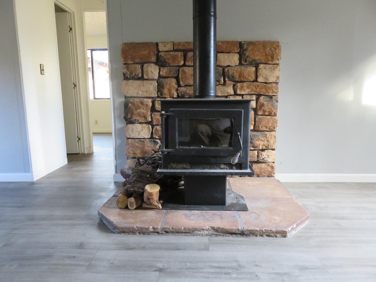 4426 Bald Mountain Road West Point, CA 95255 - Photo 32 of 45 a living room with furniture and a fireplace