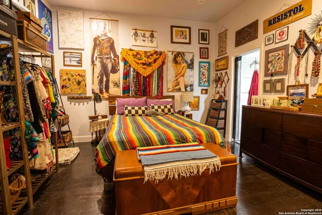 a view of walk in closet with clothes