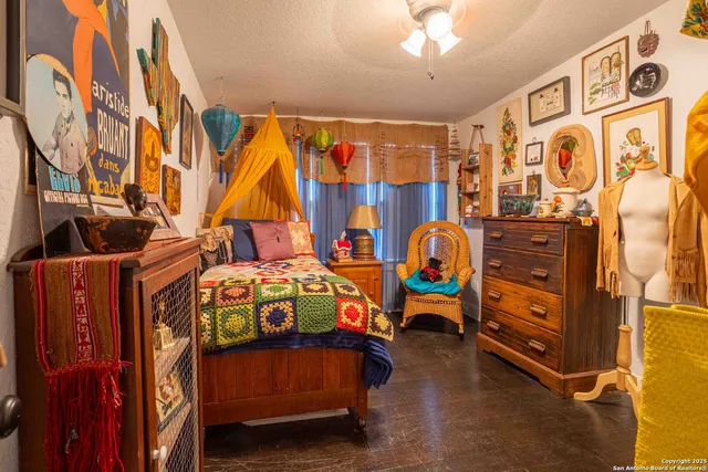 a bedroom with a bed and a mirror