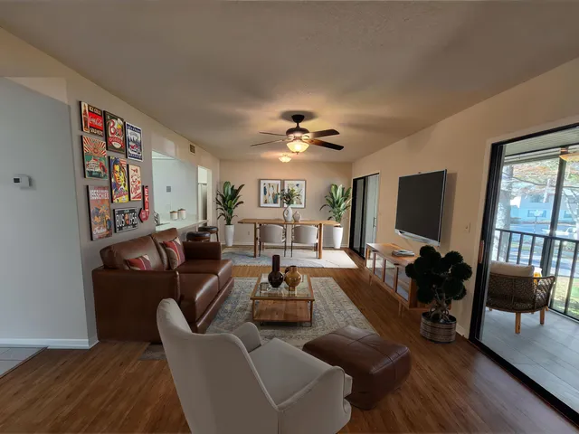 a living room with furniture fireplace and a flat screen tv