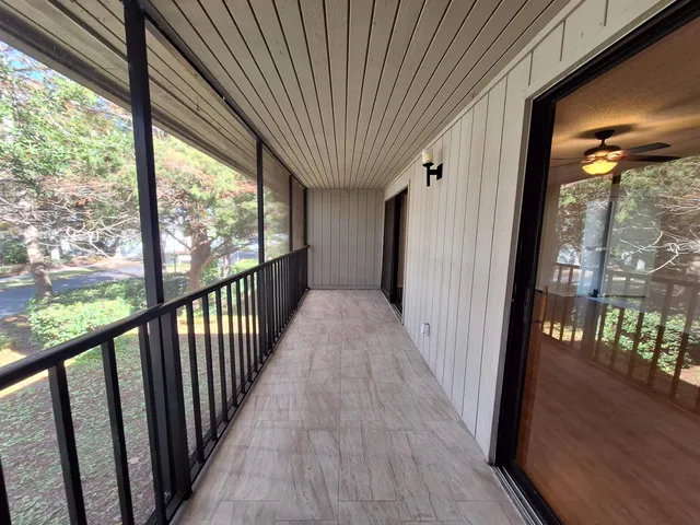 a view of a room with wooden floor and stairs