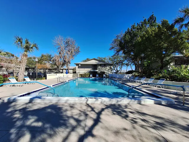a view of swimming pool with seating space