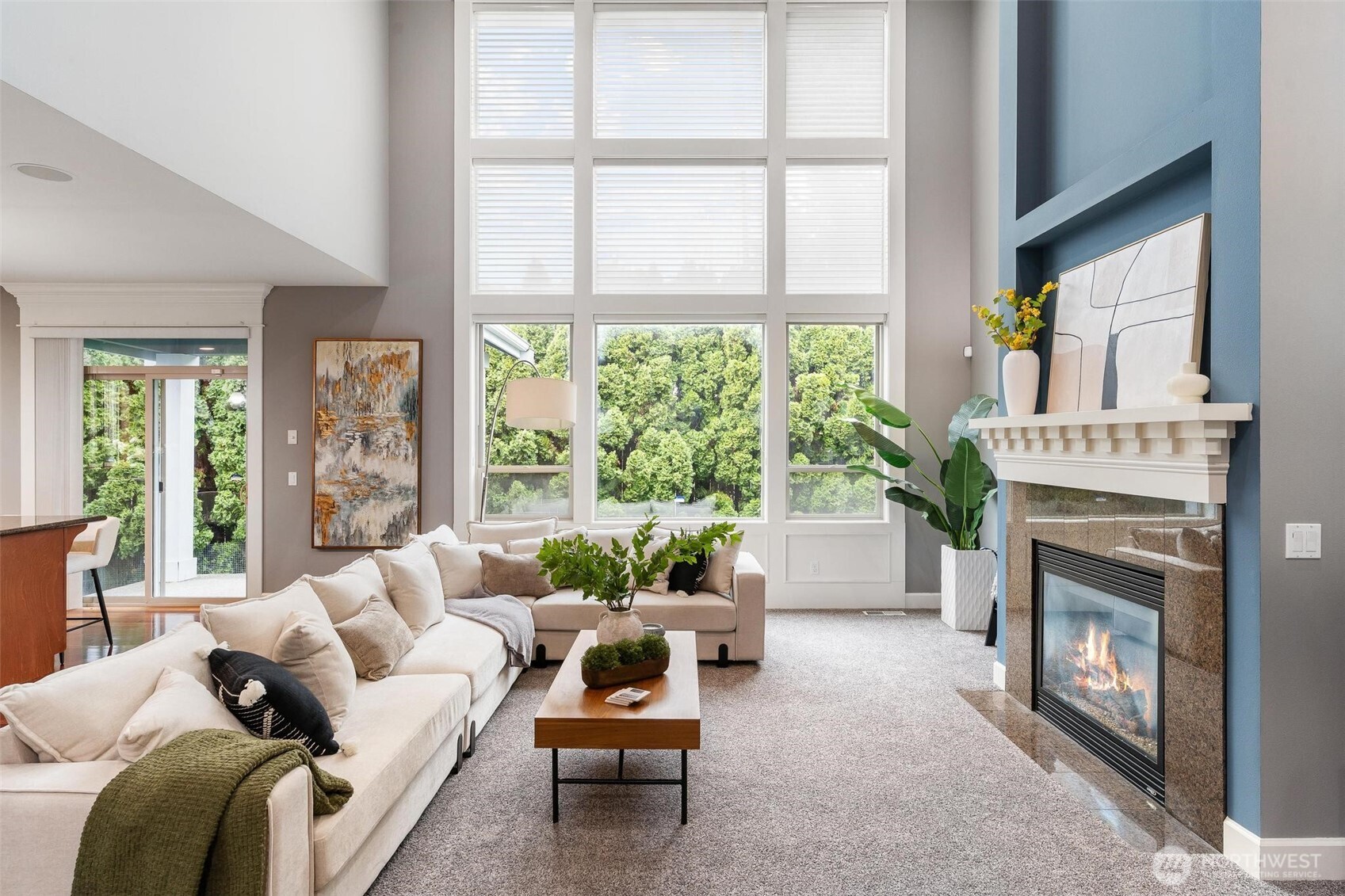 6743 Southeast 2nd Street Renton, WA 98059 - Photo 12 of 35 a living room with furniture a fireplace and a large window