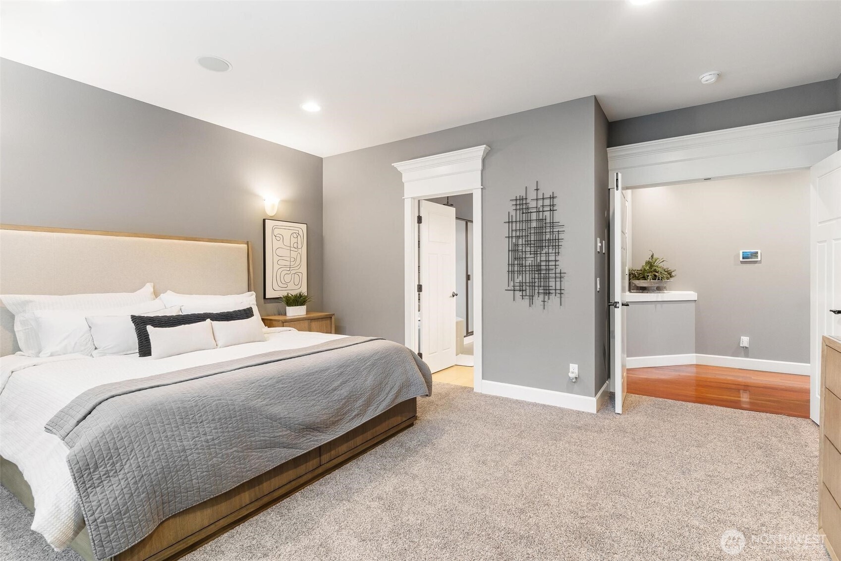 6743 Southeast 2nd Street Renton, WA 98059 - Photo 19 of 35 a bedroom with a large bed and a shower