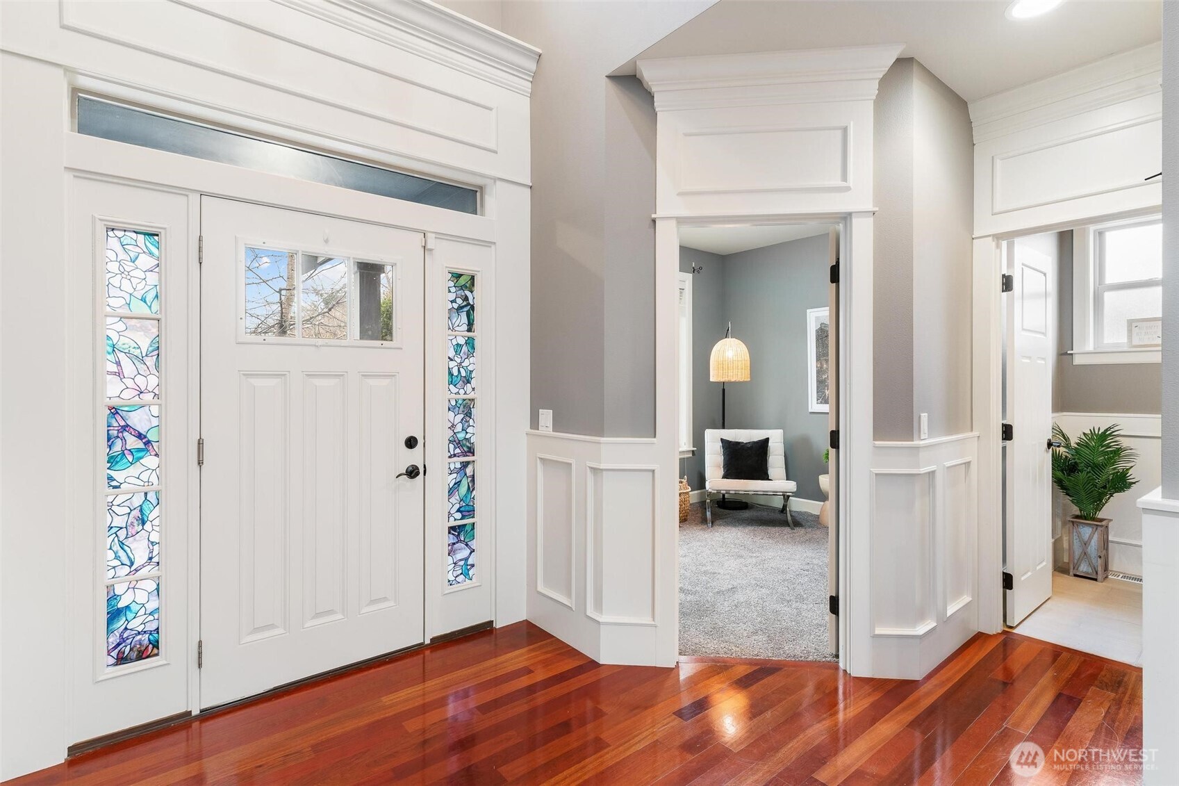 6743 Southeast 2nd Street Renton, WA 98059 - Photo 4 of 35 a view of a hallway view with furniture and wooden floor