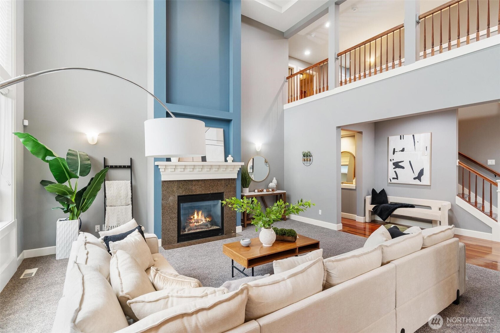 6743 Southeast 2nd Street Renton, WA 98059 - Photo 10 of 35 a living room with furniture a fireplace and a potted plant