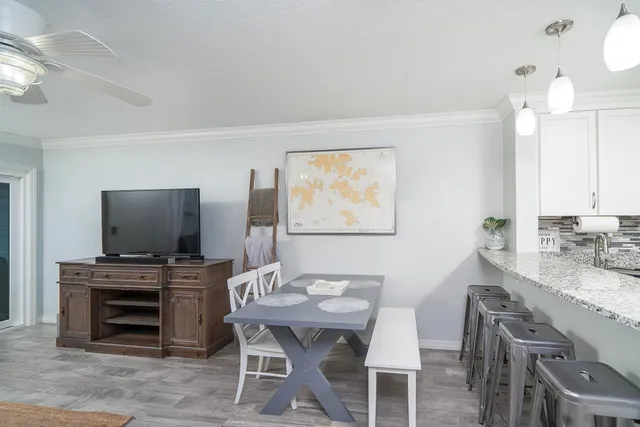 a view of a living room and chandelier