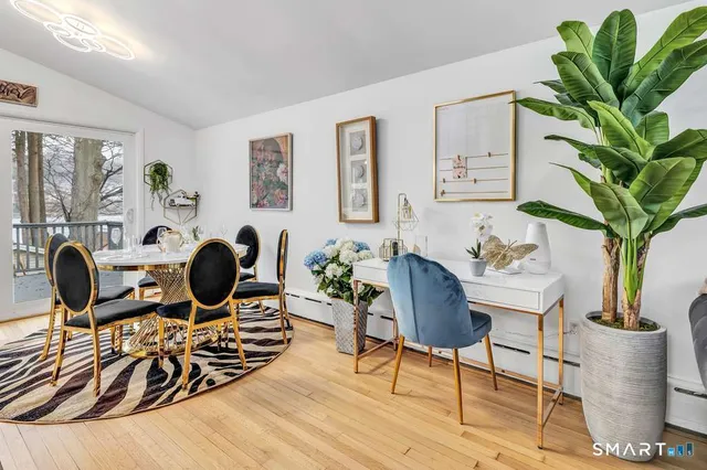 a work room with furniture and potted plant