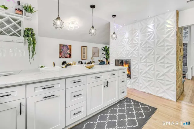 a bathroom with a sink a vanity and a mirror