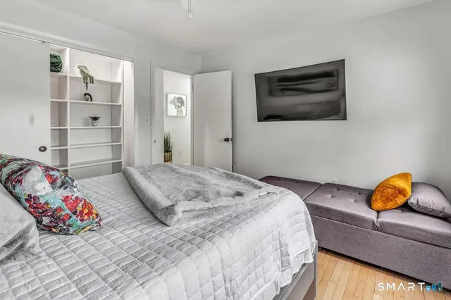 a bedroom with a bed and dresser