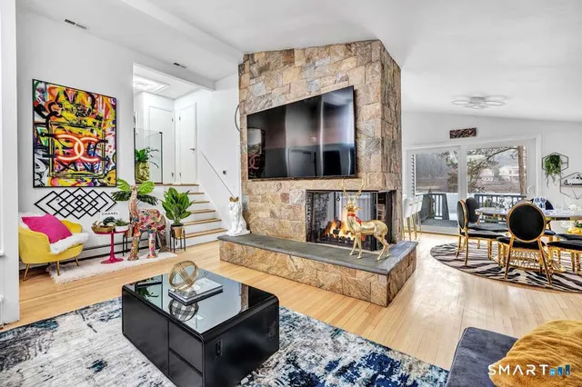 a living room with furniture and a flat screen tv