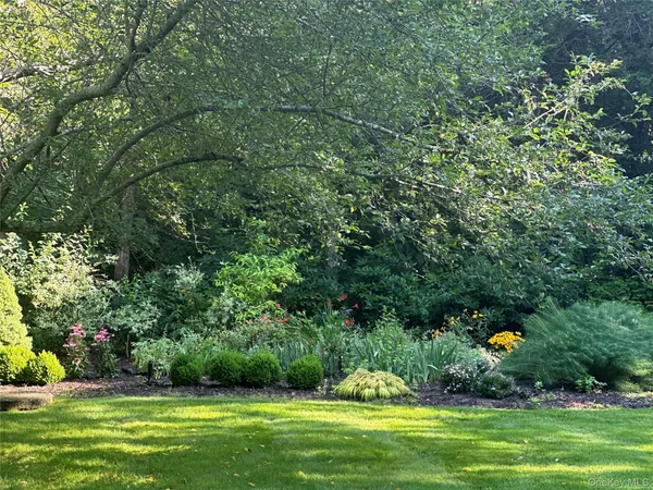 a swimming pool with trees in the background