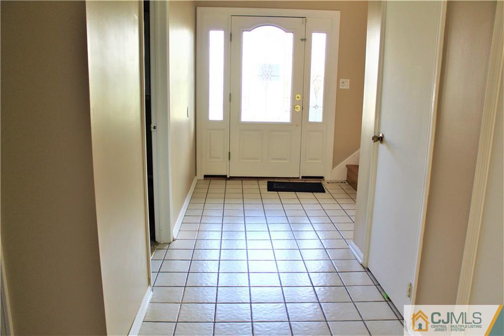 205 Normandy Road Edison, NJ 08820 - Photo 2 of 25 a bathroom with a glass door shower and a mirror