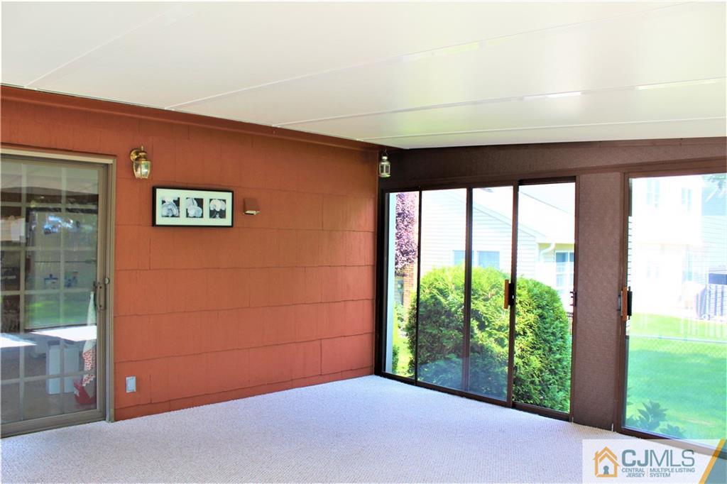 205 Normandy Road Edison, NJ 08820 - Photo 11 of 25 a view of a building with a big yard