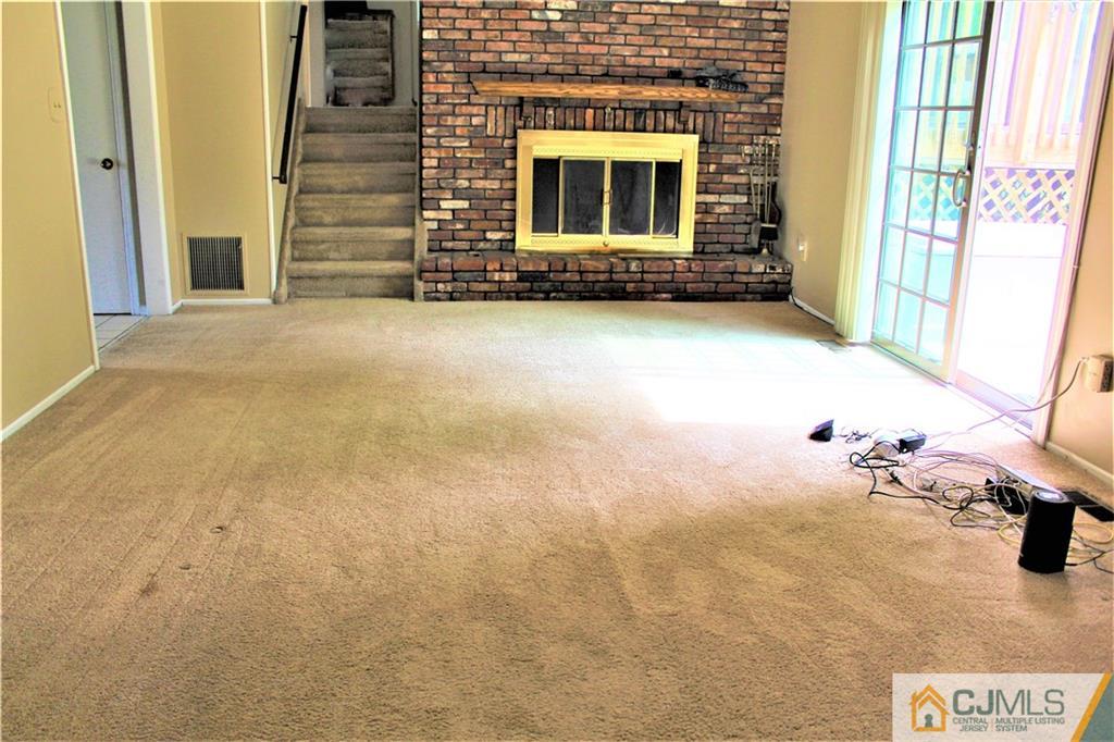 205 Normandy Road Edison, NJ 08820 - Photo 15 of 25 a view of an empty room with a fireplace