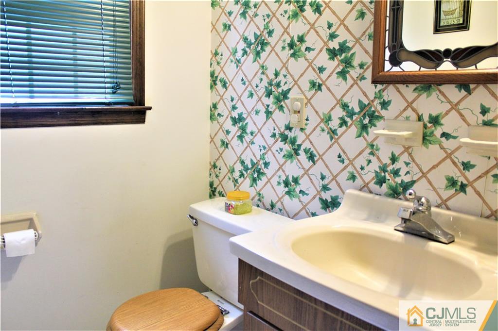 205 Normandy Road Edison, NJ 08820 - Photo 19 of 25 a bathroom with a sink and a toilet