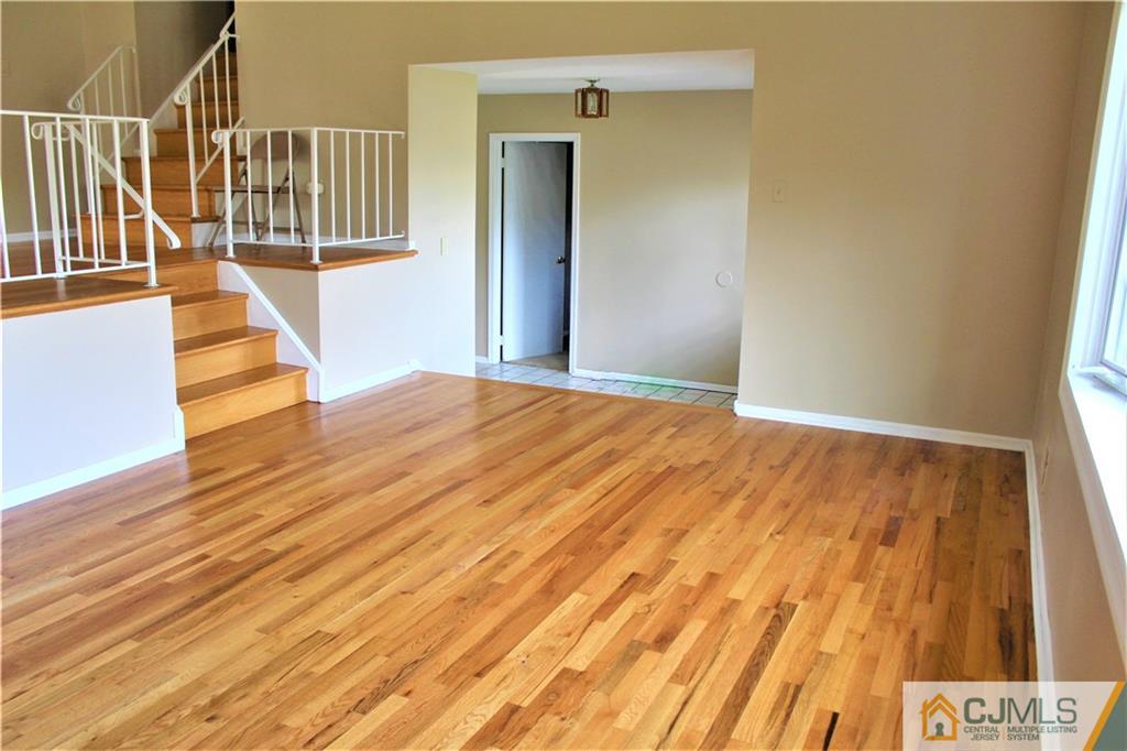 205 Normandy Road Edison, NJ 08820 - Photo 3 of 25 a view of a room with wooden floor and stairs
