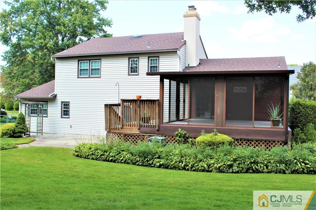 205 Normandy Road Edison, NJ 08820 - Photo 24 of 25 a front view of a house with a garden