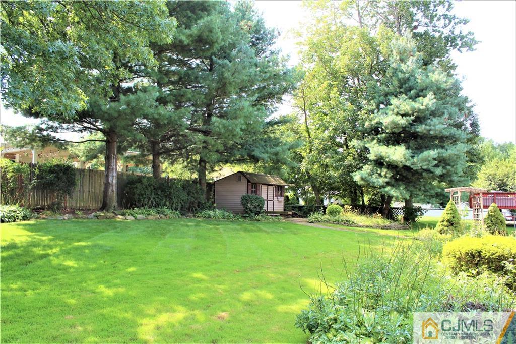 205 Normandy Road Edison, NJ 08820 - Photo 25 of 25 a backyard of a house with yard and trampoline