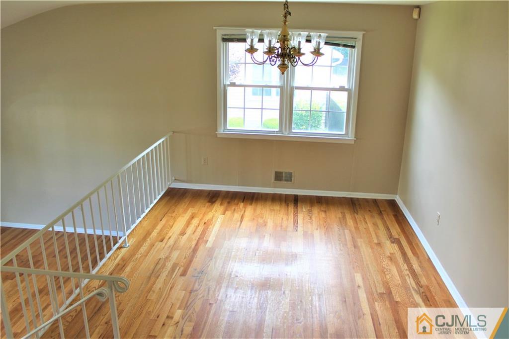 205 Normandy Road Edison, NJ 08820 - Photo 4 of 25 a view of empty room with wooden floor