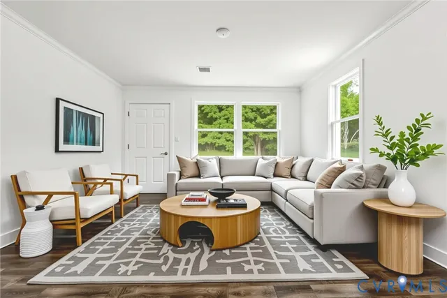 a living room with furniture a window and a table
