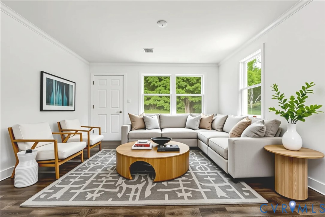 a living room with furniture a window and a table