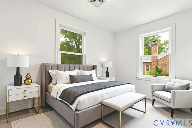 a bedroom with a bed and a window