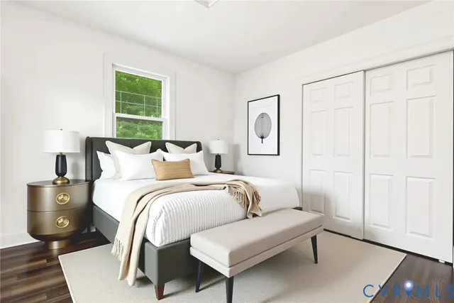 a bed room with a bed and a tv