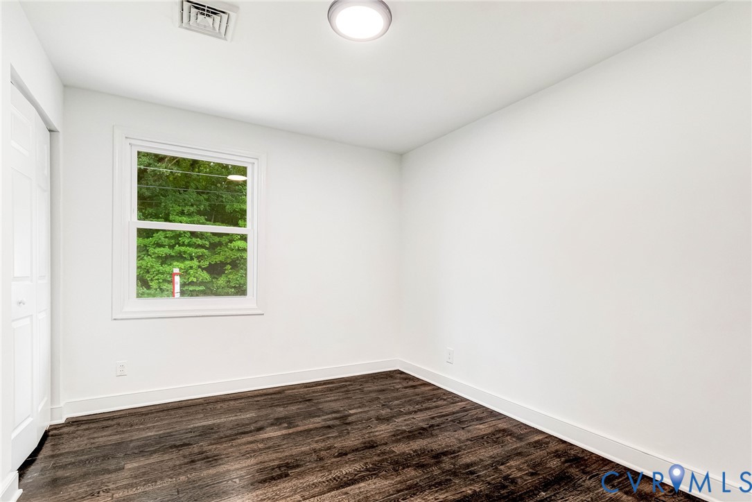 4 West Jerald Street Highland Springs, VA 23075 - Photo 9 of 19 a view of an empty room with wooden floor and a window