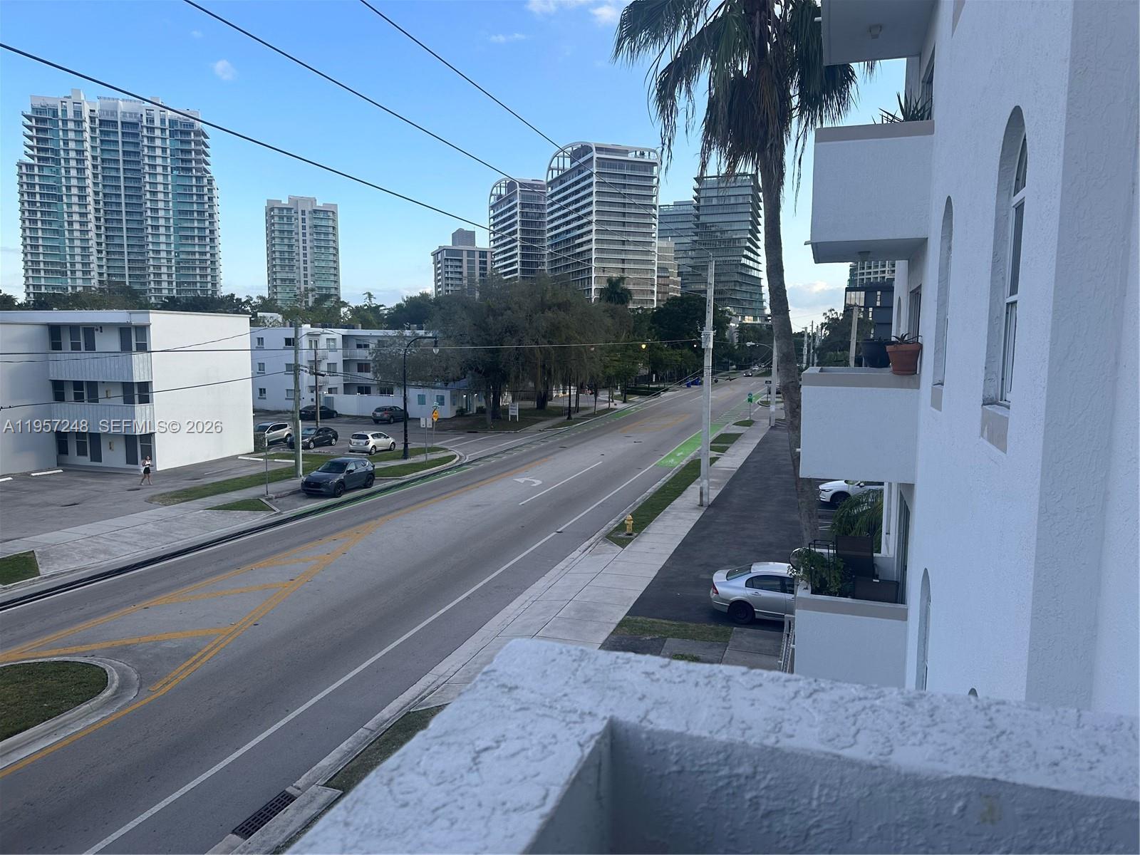 3052 Southwest 27th Avenue, Unit 301 Miami, FL 33133 - Photo 16 of 16 a city street lined with tall buildings