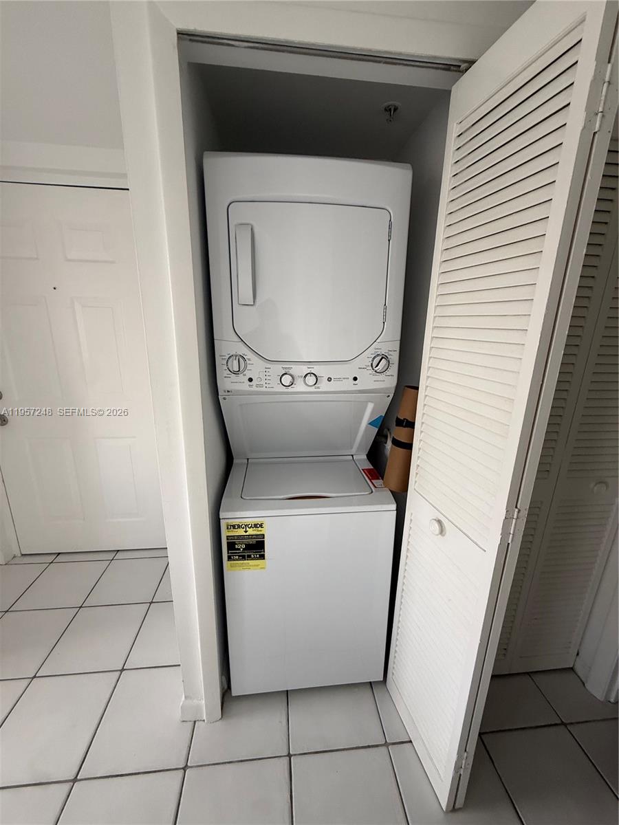 3052 Southwest 27th Avenue, Unit 301 Miami, FL 33133 - Photo 4 of 16 a utility room with washer and dryer