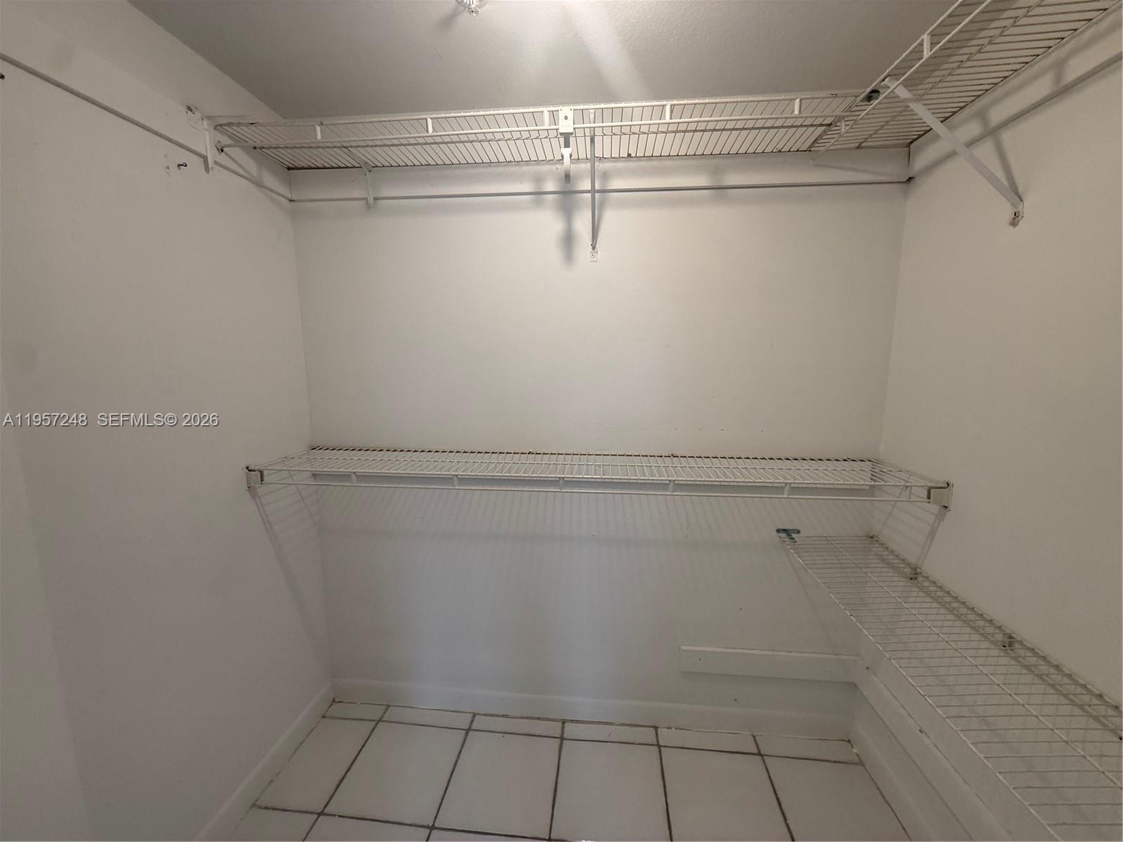 3052 Southwest 27th Avenue, Unit 301 Miami, FL 33133 - Photo 9 of 16 a view of walk in closet