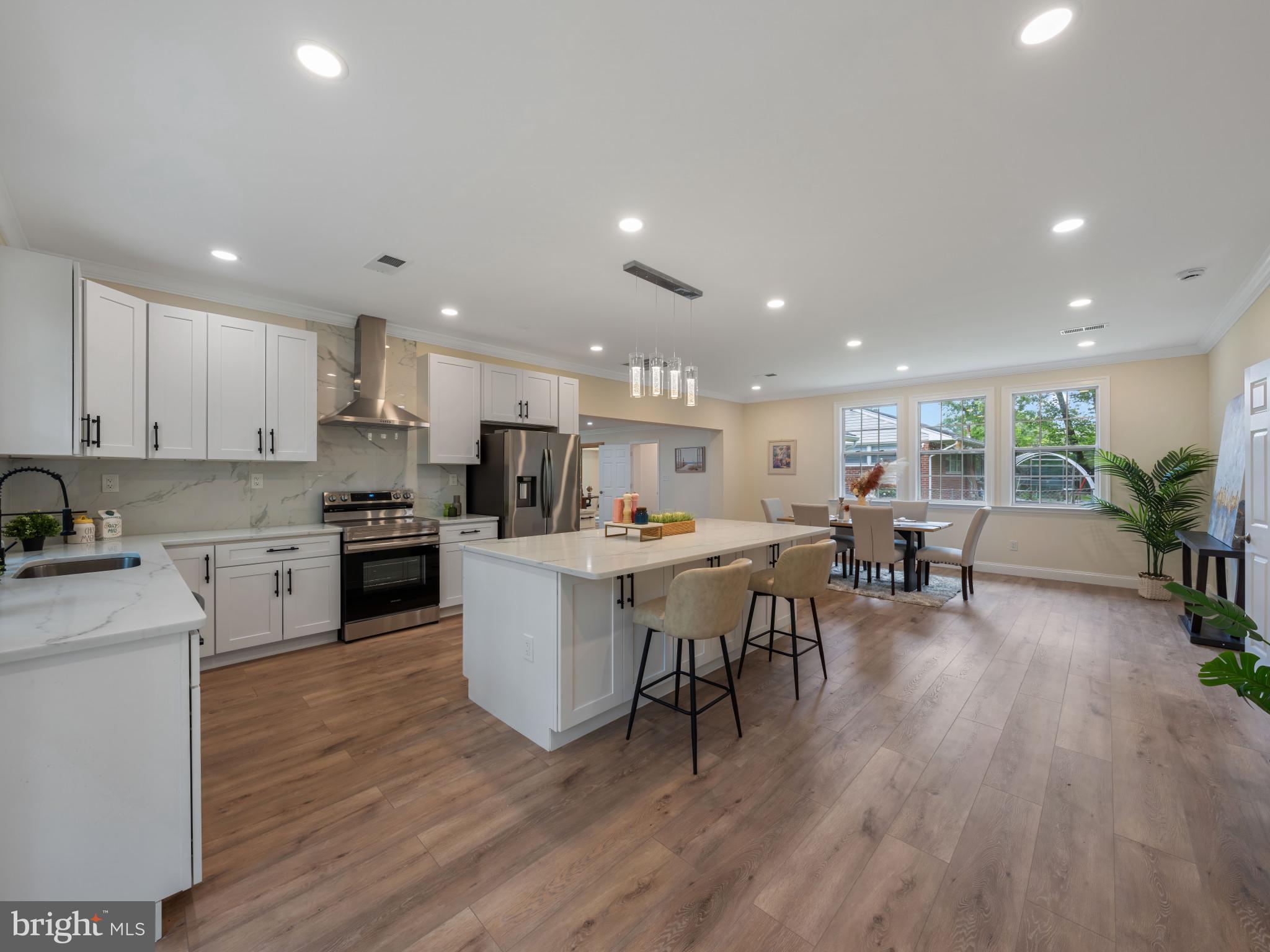 5503 Blacksburg Road Springfield, VA 22151 - Photo 1 of 30 a kitchen with a table and chairs in it