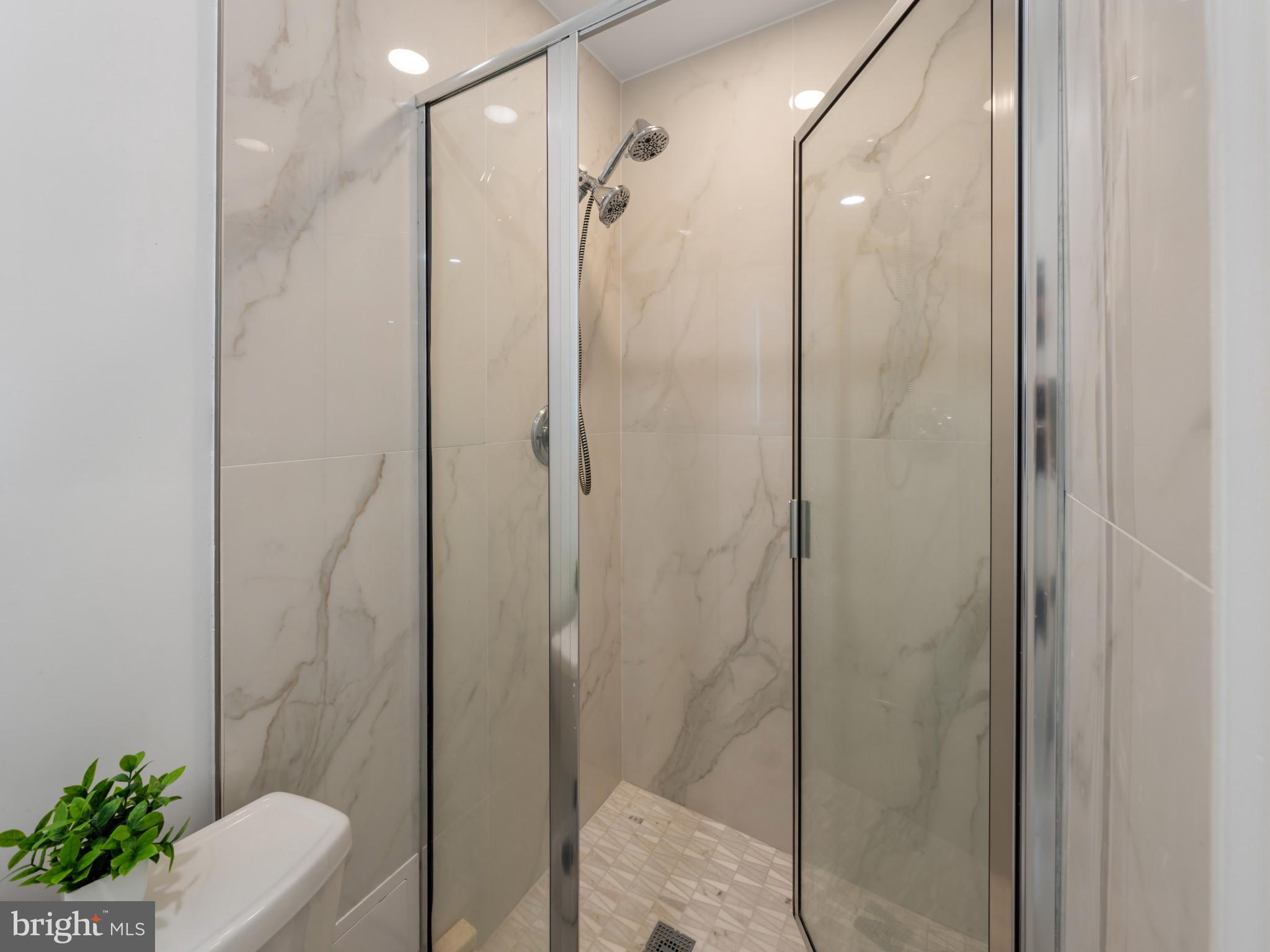 5503 Blacksburg Road Springfield, VA 22151 - Photo 17 of 30 a bathroom with a shower and a toilet
