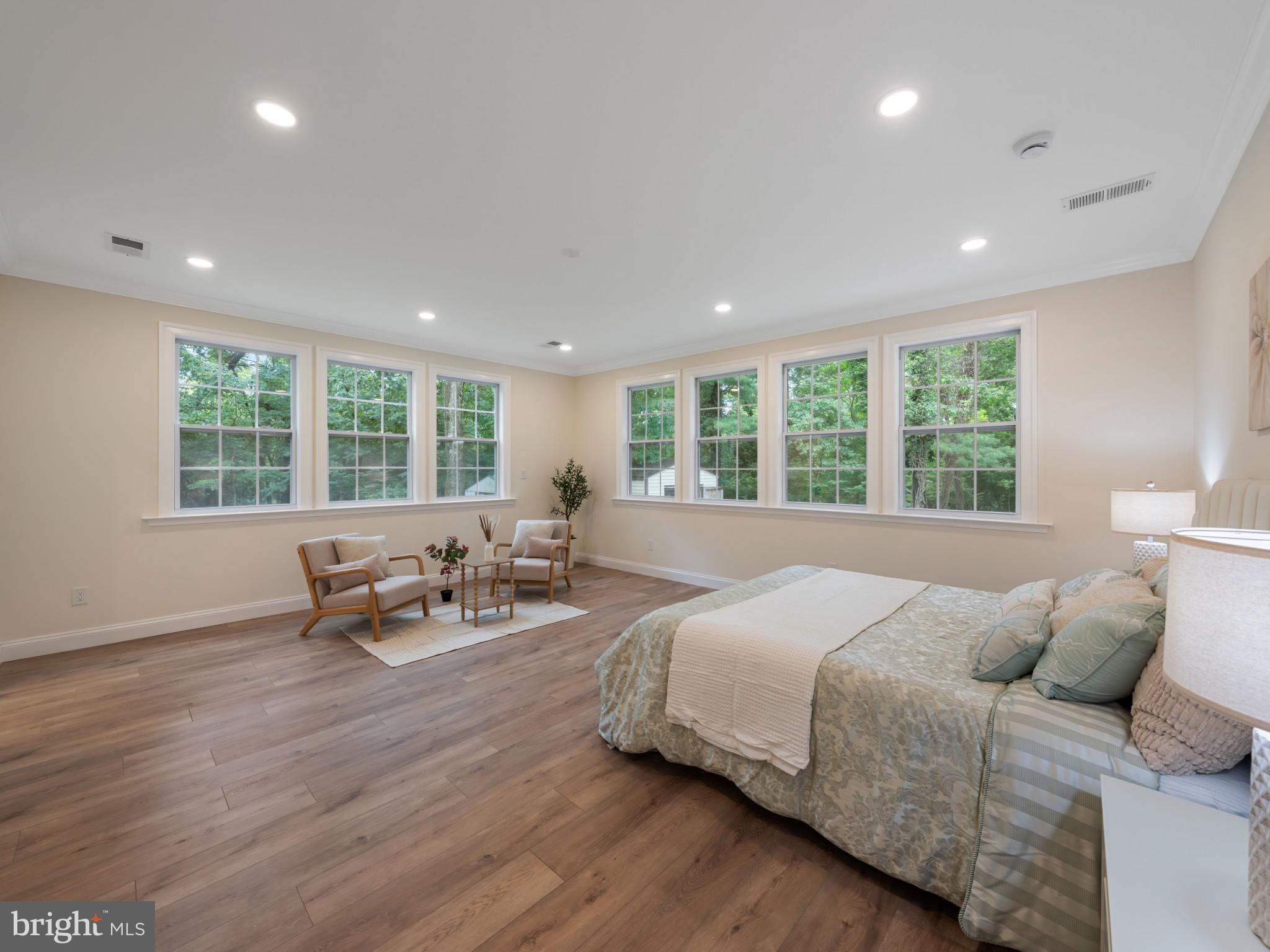 5503 Blacksburg Road Springfield, VA 22151 - Photo 18 of 30 a spacious bedroom with a bed and a large window