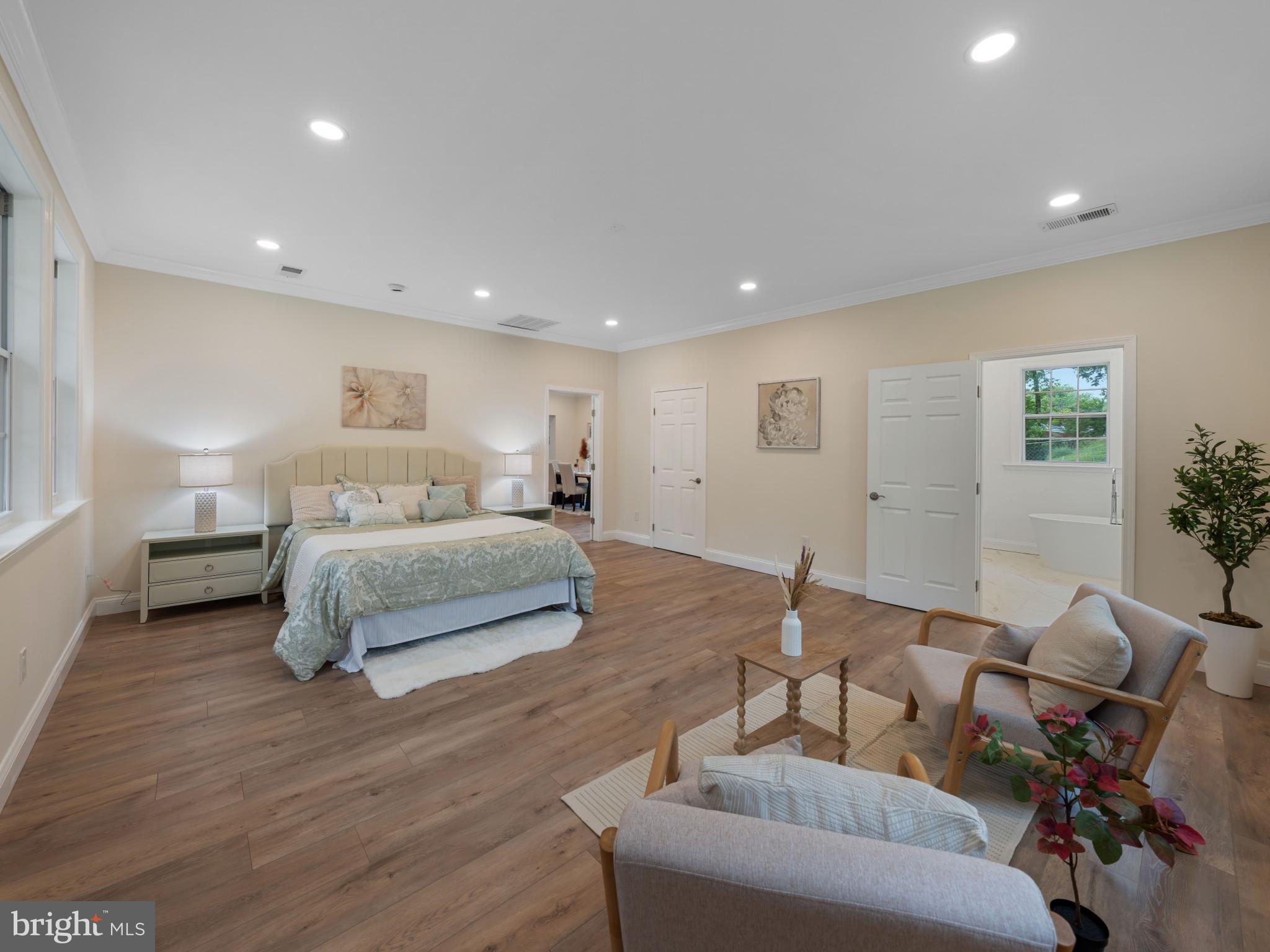 5503 Blacksburg Road Springfield, VA 22151 - Photo 19 of 30 a bedroom with a bed and wooden floor