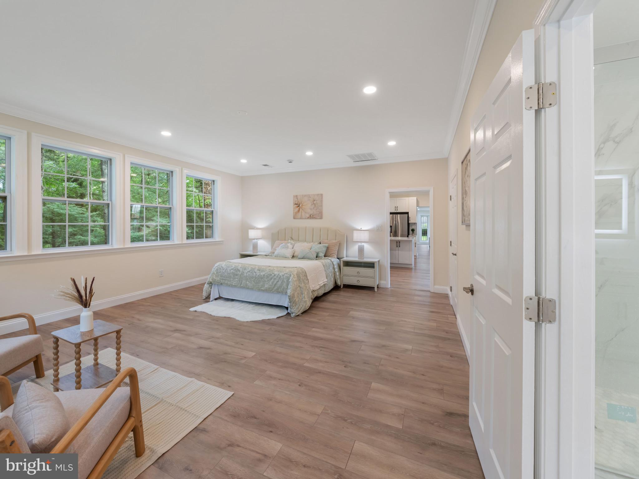 5503 Blacksburg Road Springfield, VA 22151 - Photo 21 of 30 a spacious bedroom with a large bed and windows